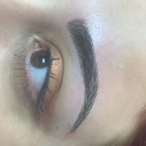 Eyebrow Tattoo result by ART iBrow Threading Salon in Riverside, CA
