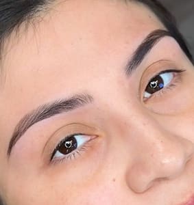 Eyebrow Tattoo result by Artistry Beauty Salon in Houston, TX