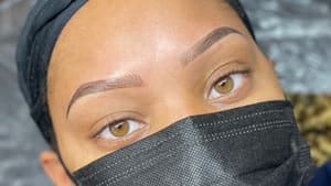 Eyebrow Tattoo result by Brown Bella Beauty - Ombre Brows, Hydrafacial, Threading, Wax, Tint and Advance Skincare Treatments in Columbia, MD
