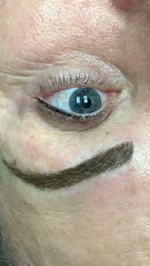 Eyebrow Tattoo result by Expressions Salon & Spa in Cedar Rapids, IA