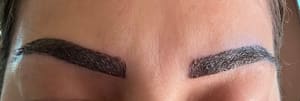 Eyebrow Tattoo result by Glam Look Threading & Salon in Grand Prairie, TX