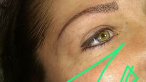 Eyebrow Tattoo result by L.A. Hair Design in Flint, MI