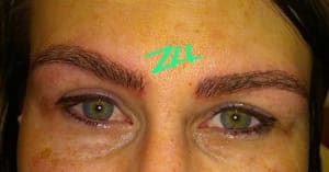 Eyebrow Tattoo result by L.A. Hair Design in Flint, MI
