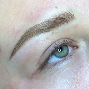 Eyebrow Tattoo result by Mandee Best Permanent Cosmetics & Piercings in Alliance, NE