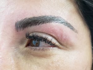 Eyebrow Tattoo result by Millie's All About You Salon Spa in Whitestone, NY