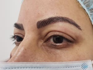 Eyebrow Tattoo result by Millie's All About You Salon Spa in Whitestone, NY