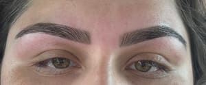 Eyebrow Tattoo result by Munaz Threading Salon & Spa in Allen, TX