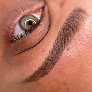 Eyebrow Tattoo result by Yeksenia Santos Cosmetic Tattoo Artistry in Alexandria, VA