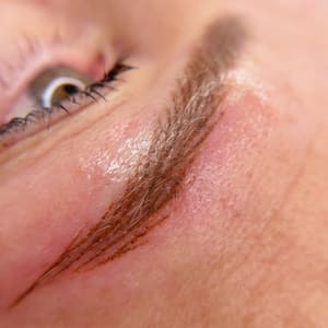 Eyebrow Tattoo result by Yeksenia Santos Cosmetic Tattoo Artistry in Alexandria, VA
