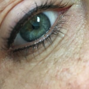 Eyeliner Tattoo result by Kelly Himes Permanent Cosmetics at Ideal Cosmetic Ink in Cedar Rapids, IA